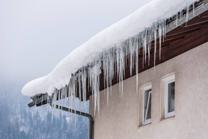 Icicles hanging on a gutter in a storm