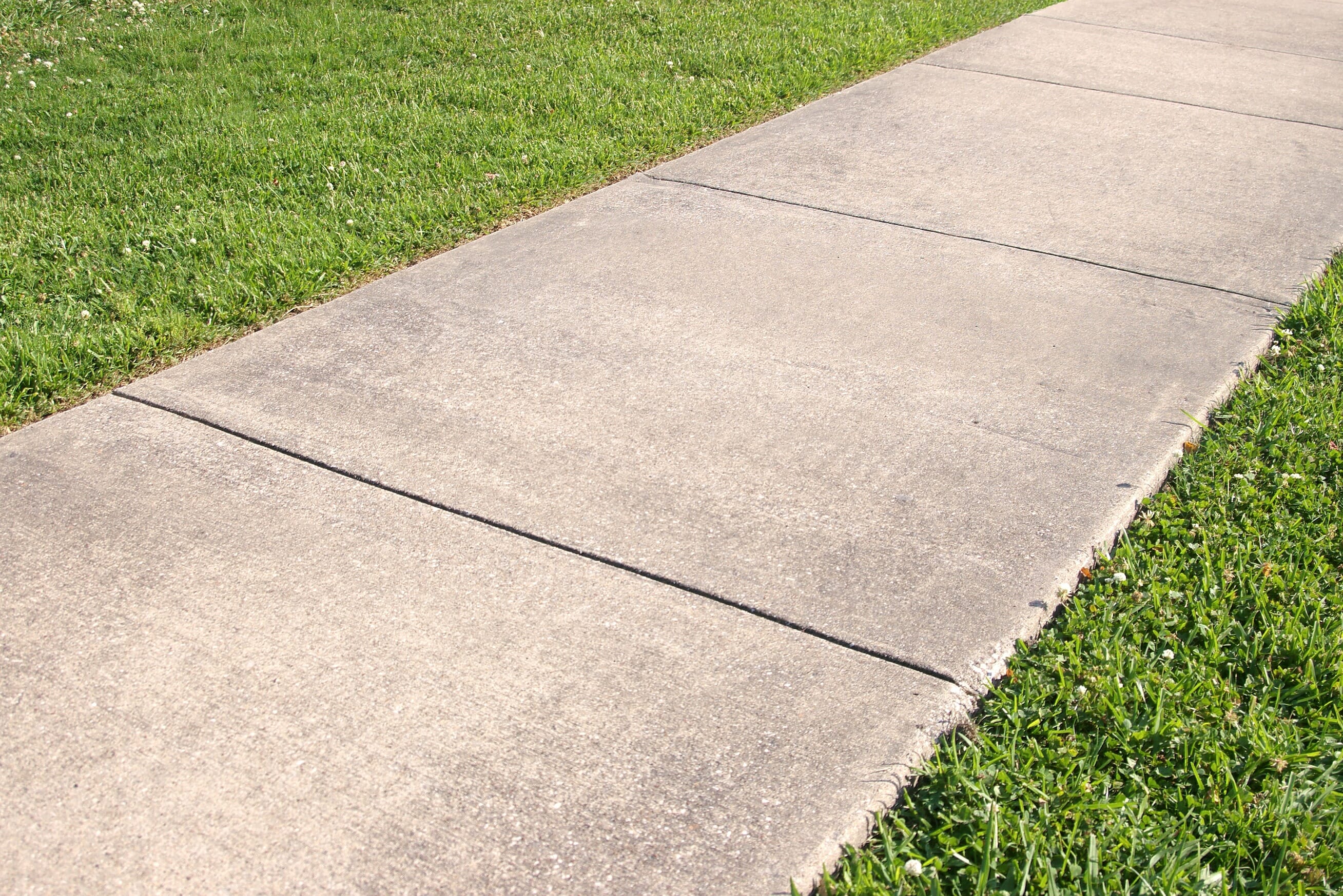 Concrete sidewalk with control joints