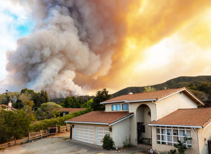 Fire near stucco house