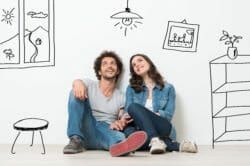 Couple looking up at their house