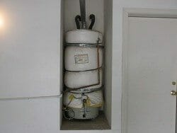 water heater in closet insulated with blanket and secured with earthquake straps