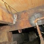 Burnt wood – near plumbing fittings