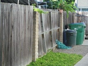 Leaning wood fence