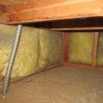 Fiberglass insulation exposed in plenum area