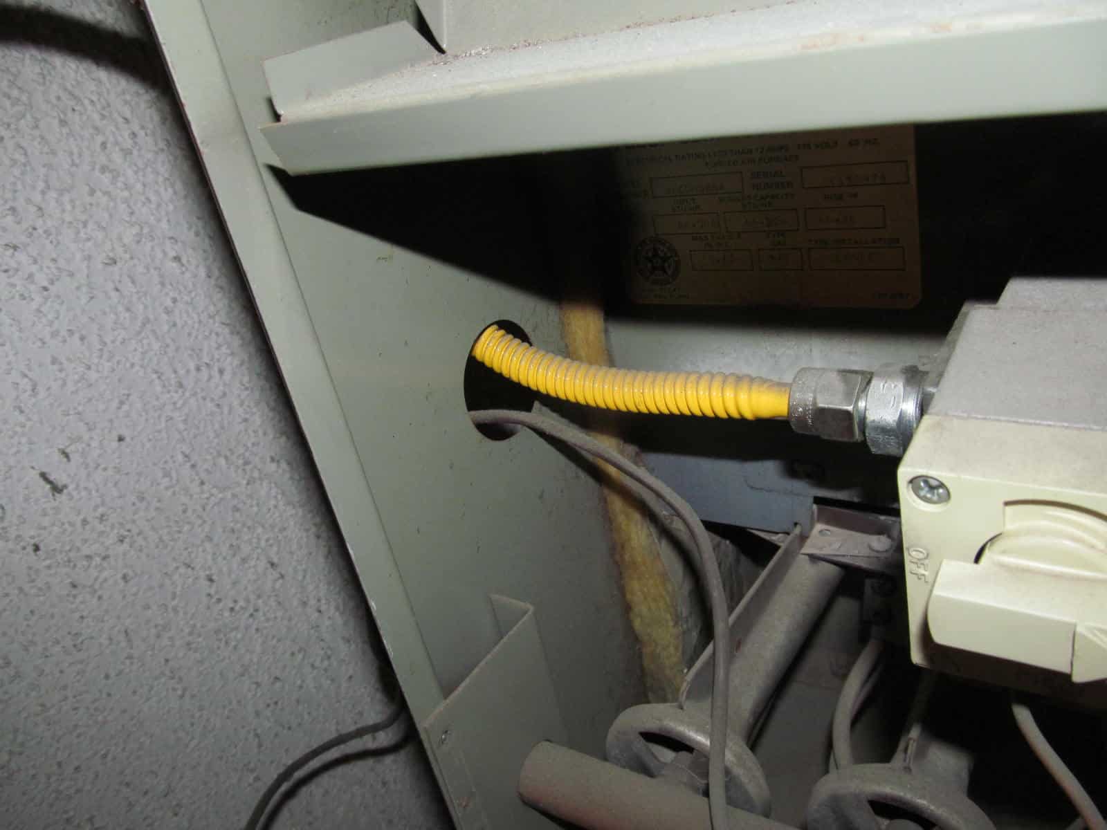 Flexible gas line against sharp metal edge of furnace Buyers Ask