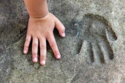 Imprint in soft soil of a hand