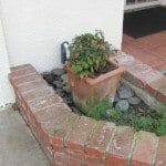 Planters Against A Home Can Cause Damage And Mold