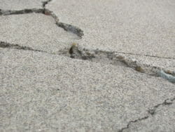 Concrete cracked and badly damaged with no repar in it