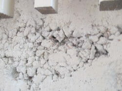 Rock pockets in concrete is where the rock, called aggregate, is exposed and is usually caused by failure to vibrate the concrete properly when pouring it.