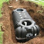 Plastic Septic tank being installed in ground