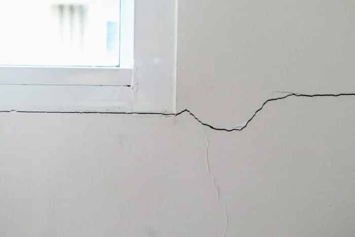 Stucco crack at window corner