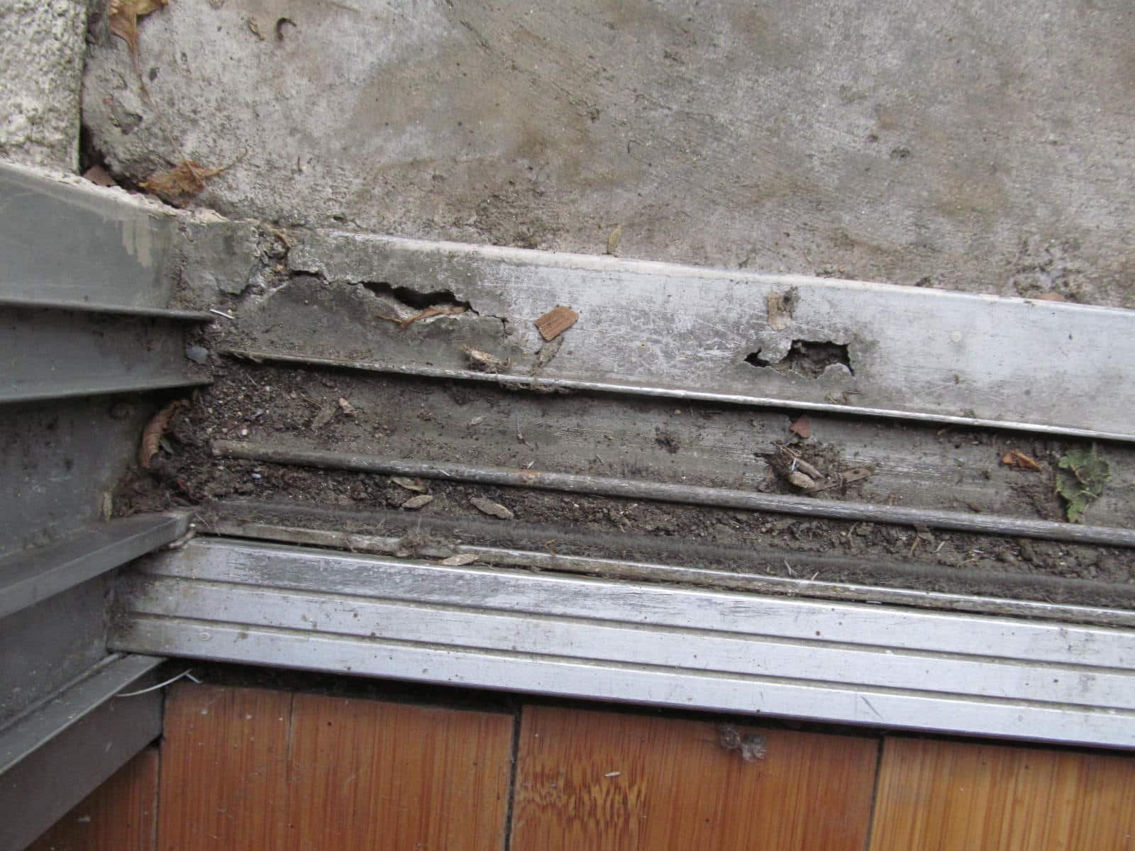 Pitted or deteriorated slider door aluminum tracks Buyers Ask