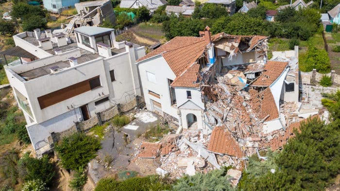 Severely damaged mansion from earthquake