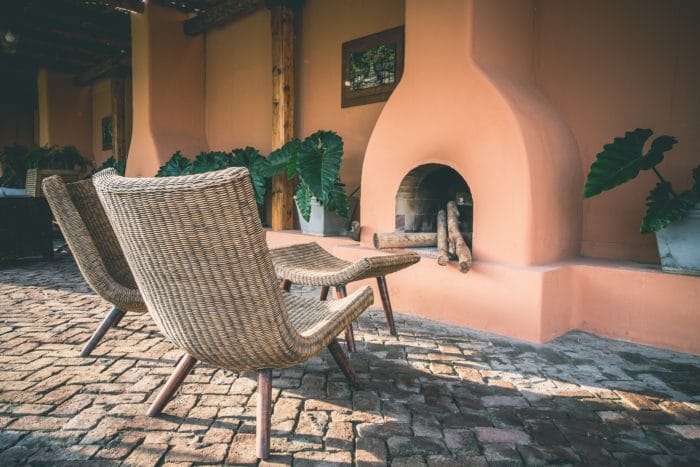 Paver patio, wicker chairs, fireplace