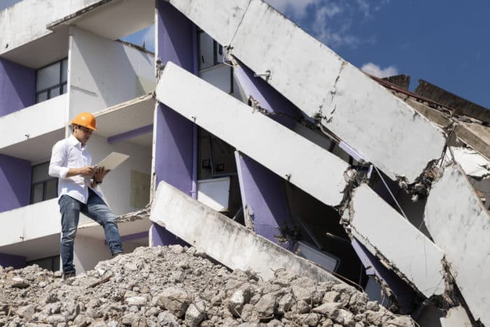 Engineer evaluating building collapse