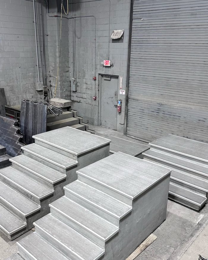 three sets of precast concrete stairs in warehouse
