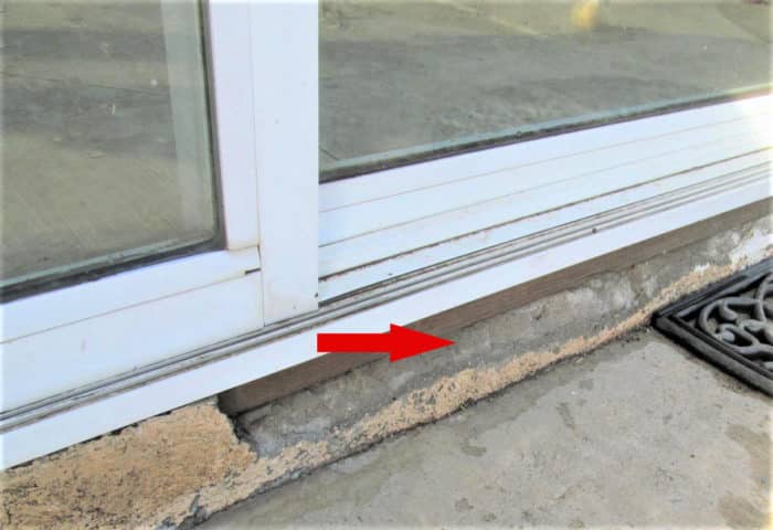 Stucco flaking off under slider door