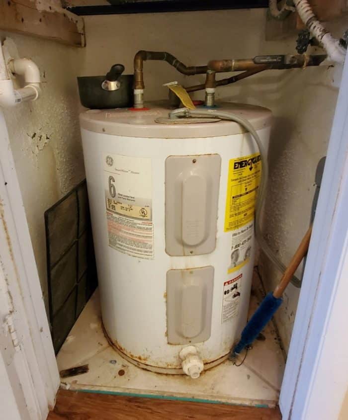 small water heater rusting in closet