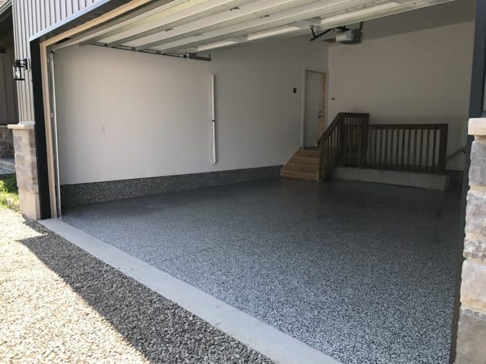 View of two car garage with epoxy coating on the floor